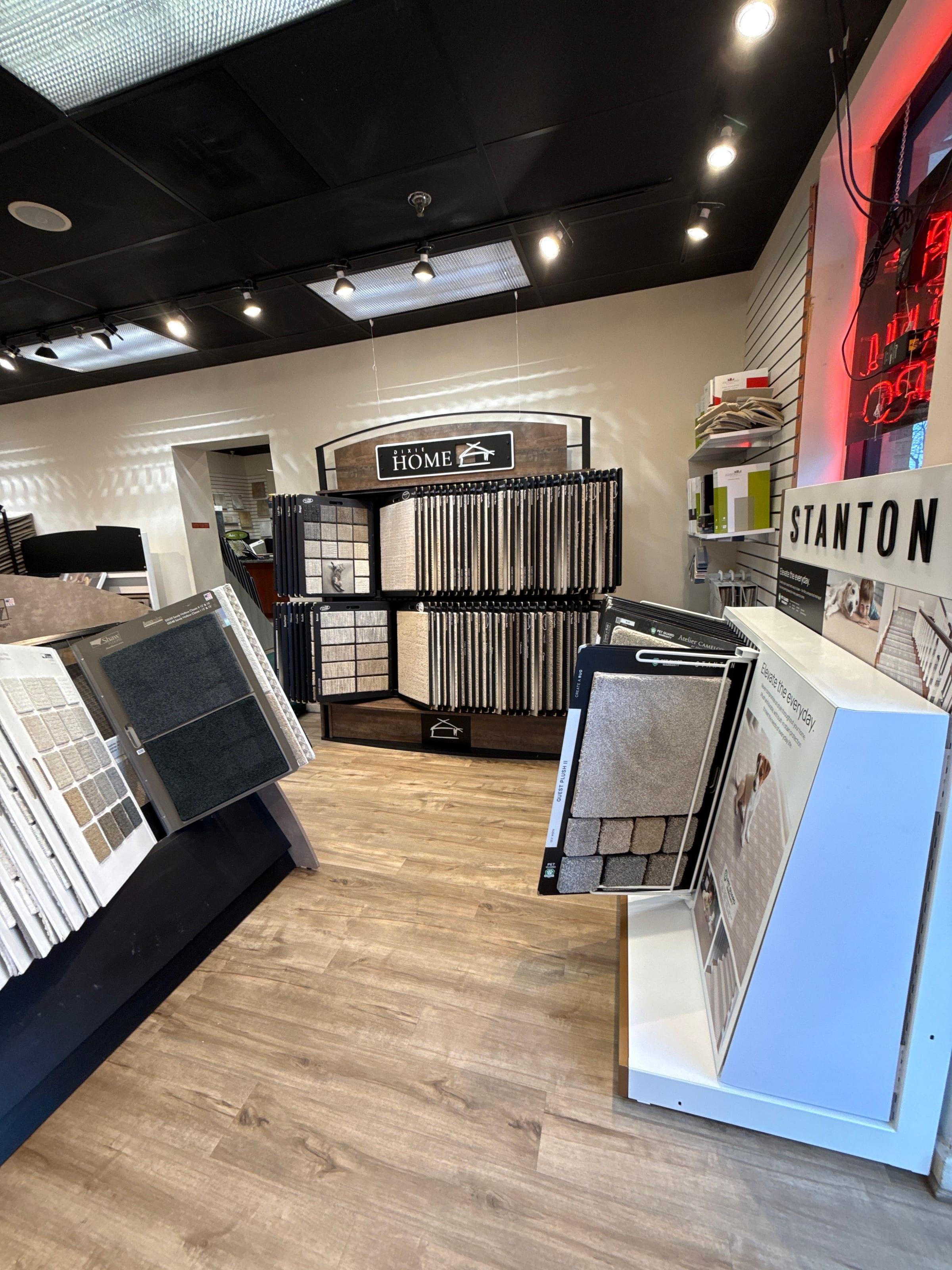 Rows of carpet samples on racks at the Olney showroom.