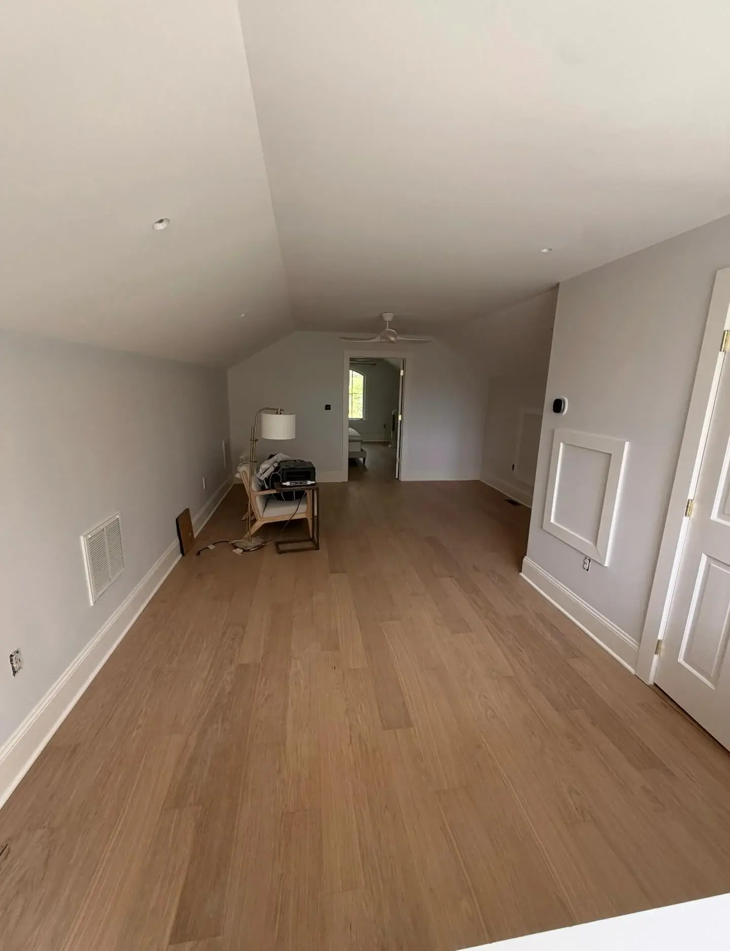 Bjelin Misty White floor in a bright room with a sloped ceiling