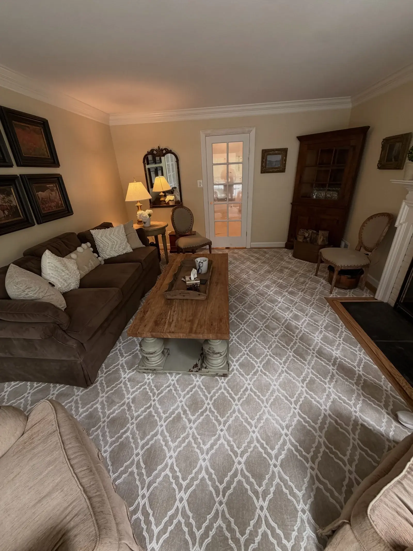 Gray geometric area rug beneath the furniture in a traditional living room