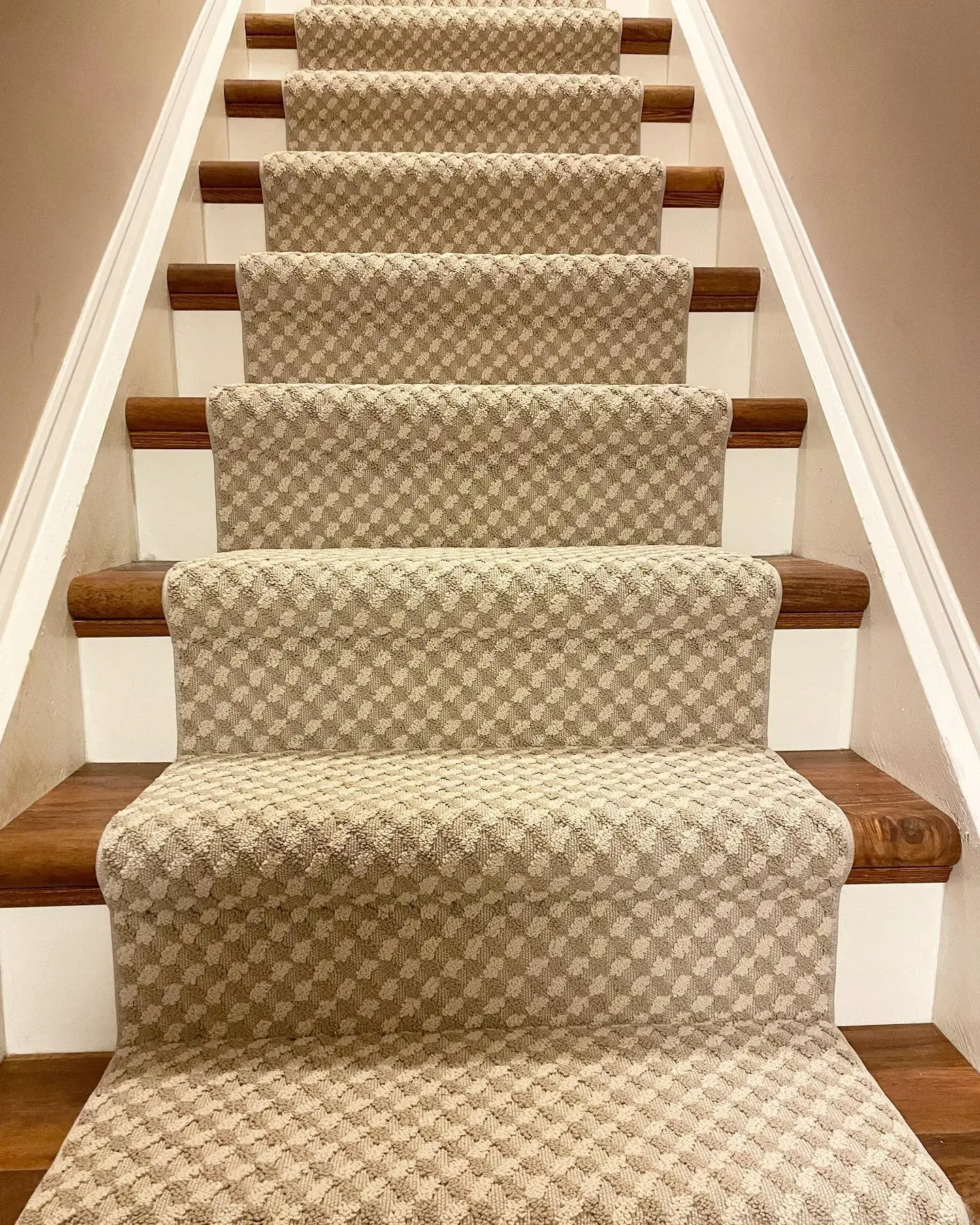 Finished Tuftex runner with a repeating geometric pattern
