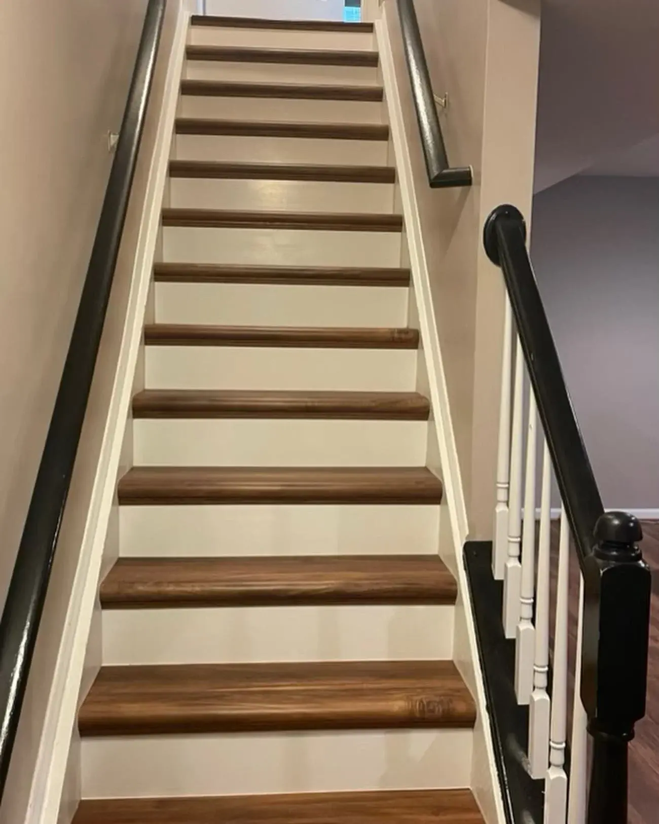 Before the runner: the same staircase with bare wood treads and white risers