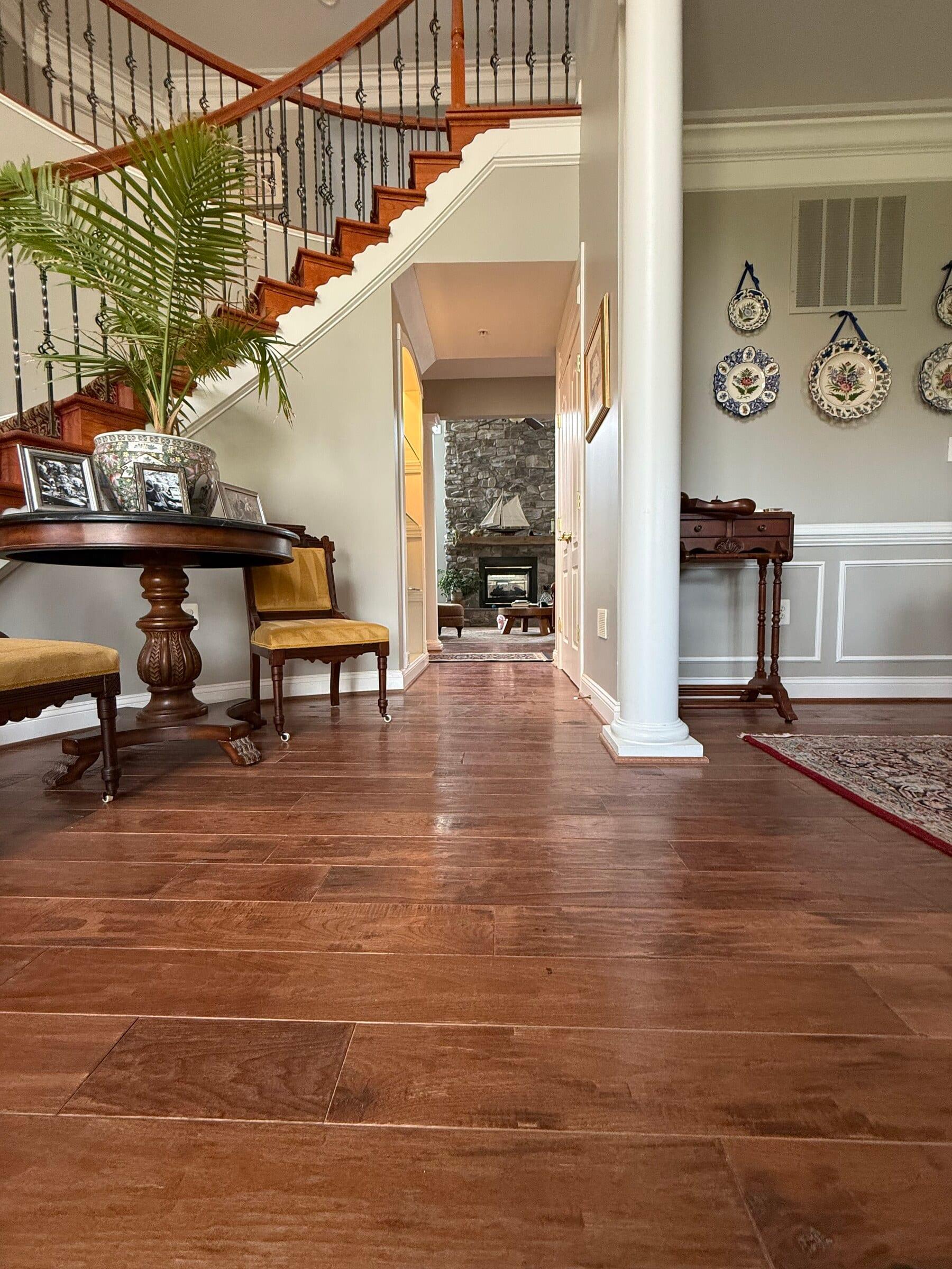 Wide-plank natural-finish oak hardwood installed by Carpet & Vacuum Expo.