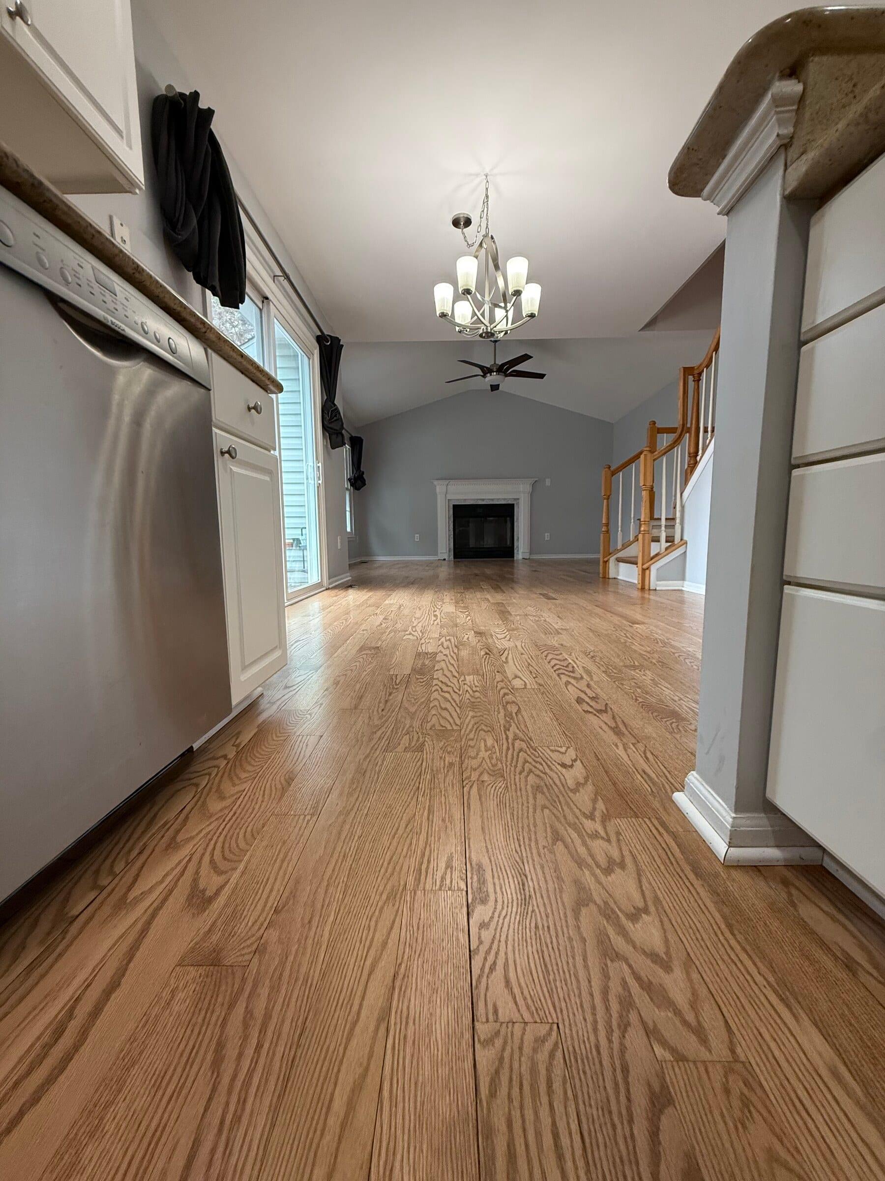 Refinished oak hardwood in a Montgomery County great room.
