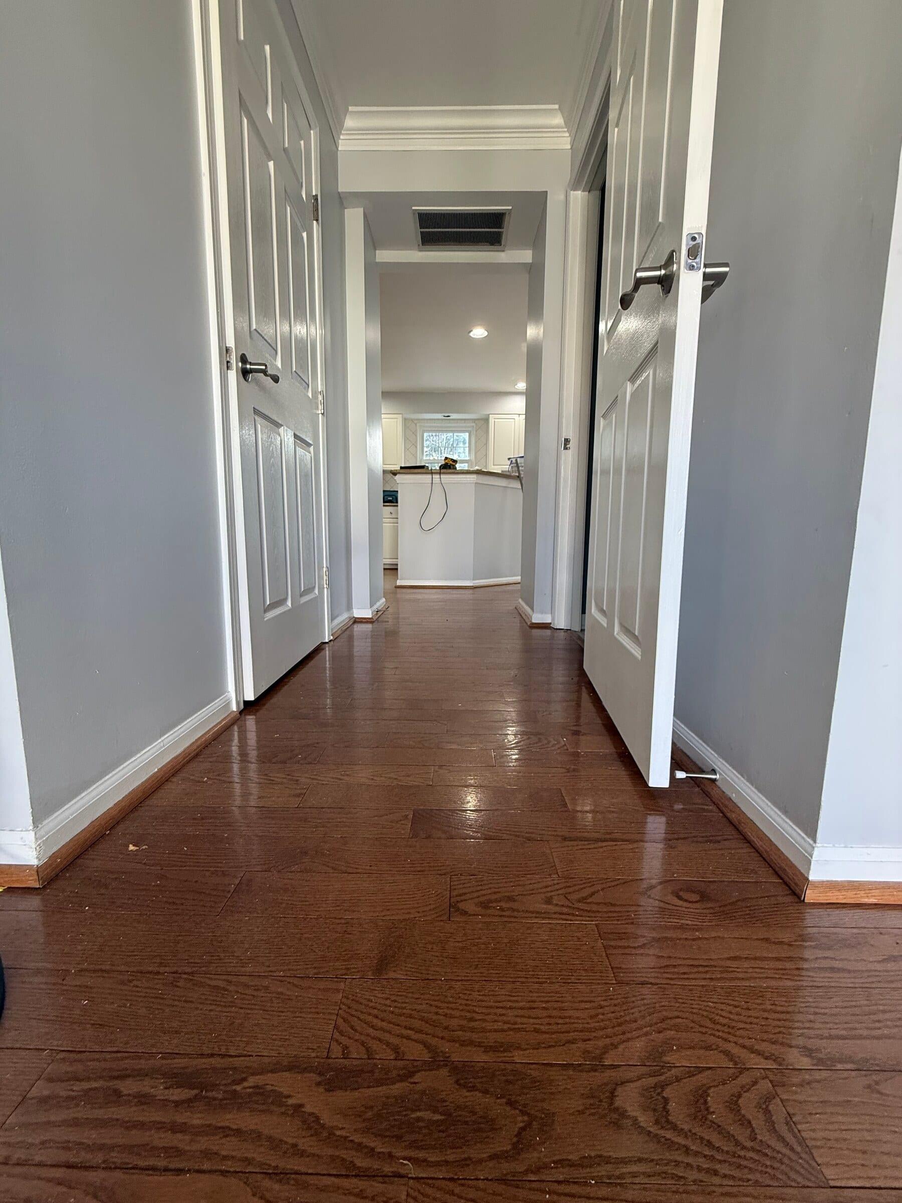 Before: hallway before the flooring work was complete
