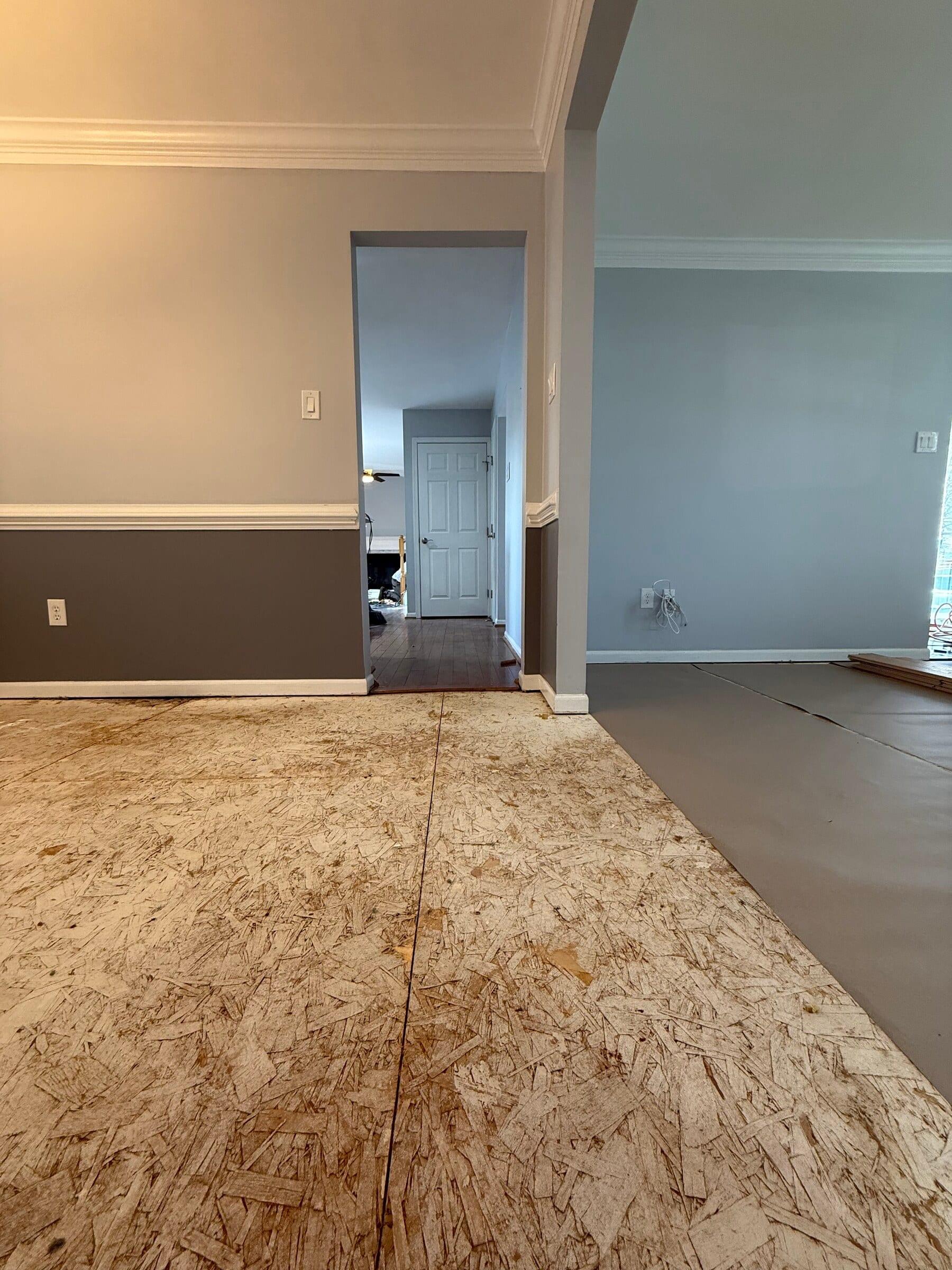 Before: room beside the hallway before the flooring work was complete
